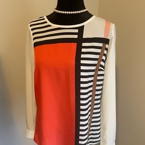 Cream blouse with orange color block and black stripes